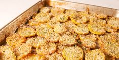 a pan filled with cooked food sitting on top of a table