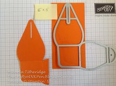 an orange paper cut out with scissors and some other items to make it look like they are