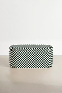 a black and white checkered box sitting on top of a table