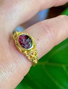 this vintage/antique ring is crafted in byzantine style in solid high purity yellow gold of approx 20-24k. unmarked but fully tested. items which are made before 1920 are not always hallmarked - antique old items often have no markings.  it is bezel set with carved garnet - intaglio- the carving is a creature with wings and reminds of a Bird or a Dragon.  weight approx 4.37g size approx 5.9 near 6 USA please see photo.  in fabulous condition -  solid and well made.  fast free insured priority sh Vintage Oval Ruby Ring With Intaglio, Victorian Yellow Gold Engraved Ring With Intaglio, Victorian Engraved Yellow Gold Ring With Intaglio, Victorian Yellow Gold Ruby Ring With Intricate Design, Victorian Ruby Ring In Yellow Gold With Intricate Design, Antique Engraved Gold Ring With Gemstone, Antique Gold Engraved Ring With Gemstone, Victorian Gold Signet Ring With Gemstone, Heirloom Gold Ruby Ring With Filigree