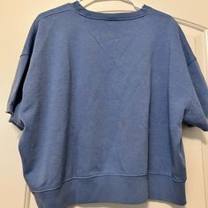 Brand New. Never Wore. Still Has The Tags On It. Great Condition. Sporty Washed Blue Relaxed Fit Top, Light Blue Athleisure Top For Loungewear, Light Blue Relaxed Fit Sporty Top, Relaxed Fit Washed Blue Top For Loungewear, Oversized Blue T-shirt, Sporty Light Blue Tops For Loungewear, Casual Washed Blue Crew Neck Top, Light Wash Tops For Loungewear, Athleisure Light Blue Crew Neck Top