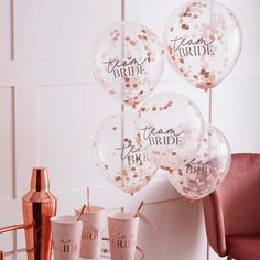 some balloons and cups on a table