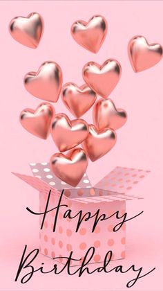 a pink box filled with lots of hearts on top of a pink background and the words happy birthday