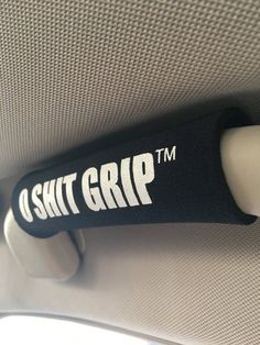 a black and white sticker on the side of a car seat with it's arm