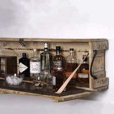 an old wooden crate filled with liquor bottles