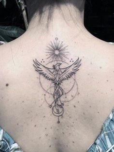 the back of a woman's neck with a tattoo on it