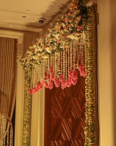 the flowers are hanging from the ceiling in the room