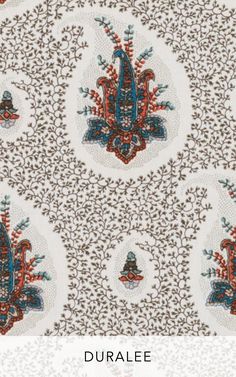 an intricately designed wallpaper with blue, red and white designs on it's surface