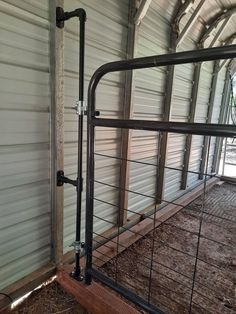 the inside of a building with metal railings and wood flooring in front of it