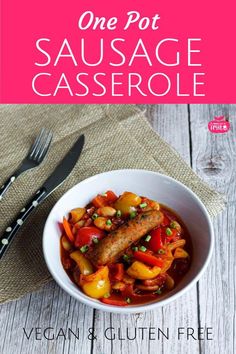 one pot sausage casserole with vegetables in a white bowl on a wooden table