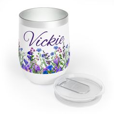 a white canister with a lid next to a container that says vickie on it