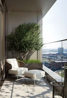 an outdoor balcony with chairs and potted tree on the roof top, overlooking cityscape