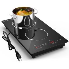 an electric stove with a pot on the burner