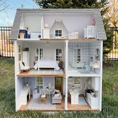 a doll house with all the furniture and accessories in it's own backyard area