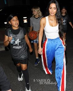 Fashion Bomb Daily on Instagram: "@kimkardashian attended daughter #northwest ‘s basketball game wearing a white tank and @vetements_official snap track pants. Thoughts? 📸…" Basketball Pants Outfit Women, College Basketball Game Outfit Women, Basketball Game Fits, Game Day Outfit Basketball, Basketball Girls Outfits, Basketball Outfit, Court Outfit, Husband Fashion