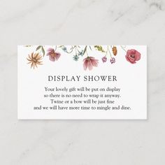 a white business card with flowers on it and the words display shower written in black ink