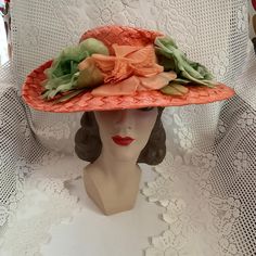 Vintage 1950's 1960's hat. Orange cellophane straw adorned with Orange and Green flowers. The label is *Styled By Abbye'*. Larger size hat. *SCROLL DOWN FOR CONDITION & MEASUREMENTS* CONDITION: No issues noted. MEASURES: Inside circumference~22" Height~4" Front to back~6 1/2" Left to right~7 1/2" *WE APOLOGIZE~BUT WE NO LONGER SHIP TO GERMANY, ITALY OR SPAIN. IF ORDERS COME IN FROM GERMANY, ITALY OR SPAIN, WE WILL HAVE TO CANCEL THEM AND REFUND YOUR MONEY. SORRY FOR THIS INCONVENIENCE* Styled By, 1960s Hats, Fleur Orange, Elegant Hats, Pillbox Hat, Flower Fashion, Orange Flowers, Green Flowers, Green Orange