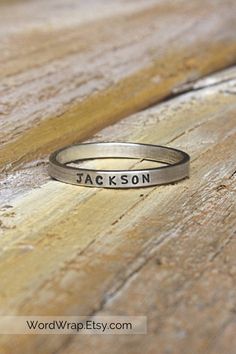 These extra tiny minimalist name rings are simple enough to wear every day, and also perfect for stacking and layering. They make the perfect bridesmaid gift, mother's day gift, and are also great for birthdays, graduation or any special event! These custom rings can be personalized with hearts, names or numbers that are meaningful to you. Layer them together or with other stackable rings for a look as unique as you are. Details: ~ Ring width: 2mm ~ Ring thickness: 1mm ~ Letter size: 1mm ~ Made Custom Name Adjustable Stackable Rings, Adjustable Stackable Rings With Custom Name, Personalized Adjustable Rings For Everyday, Mother's Day Adjustable Stackable Rings With Custom Name, Meaningful Hand Stamped Stackable Promise Rings, Adjustable Stackable Rings With Custom Name For Mother's Day, Sterling Silver Stackable Rings With Custom Name, Simple Personalized Adjustable Rings, Everyday Stackable Rings With Custom Name