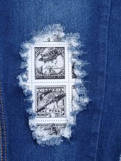 the back of a pair of jeans with patches on them