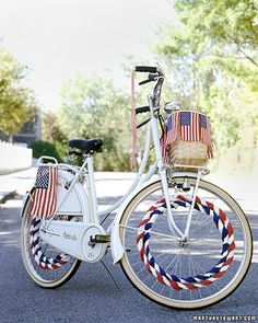 a white bicycle with an american flag basket