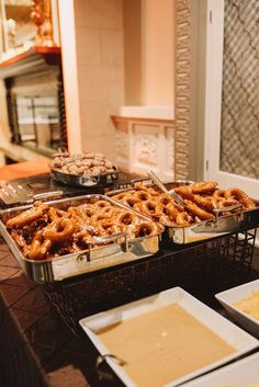 several trays filled with different types of food