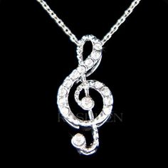 PERFECT GIFT FOR MUSIC FANS, INSTRUCTOR, TEACHER OR STUDENT!!Great Gift for Bride who are musician.This sparkling Crystals TREBLE CLEF music melody pendant with Swarovski crystals measuring 3/8"  (9mm) wide X 3/4"  (20mm) high. It comes with a FREE 15 1/4" inch (38.2cm) with 2" extender chain rhodium plated fine cable chain necklace with lobster clasp. Crystal Color: Crystal ClearGreat piece for your collection!===================Prices are in US$.For shipping policies and other important inform Paw Print Charm, 18th Birthday Gifts, Music Jewelry, Dope Jewelry, Treble Clef, Sterling Silver Chain Necklace, Christmas Gifts For Friends, Music Note, Brooch Jewelry