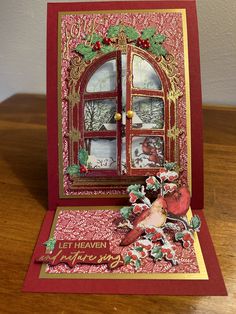 a christmas card with an open window