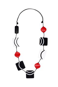 Experience bold style with our Posi Curve Necklace. Hand-painted artistic resin beads in black and white stand out, accented with smaller red beads for a pop of color. Make a statement and elevate any outfit with this unique accessory! Adjustable Largest Bead: 1.75 inches Necklace Length: 30-38 inches