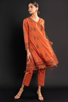 Orange Printed Cotton Set, Orange Embroidered Lawn Suit With Long Sleeves, Embroidered Orange Lawn Suit With Long Sleeves, Orange Embroidered Long Sleeve Lawn Suit, Embroidered Long Sleeve Orange Lawn Suit, Unstitched Long Sleeve Orange Lawn Suit, Orange Cotton Sets With Printed Motifs, Orange Unstitched Cotton Sets, Unstitched Orange Cotton Sets