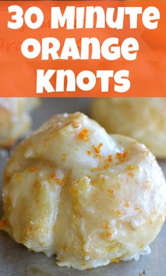 an orange donut with white icing and sprinkles on it, in front of the words 30 minute orange knots