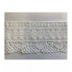 a white crocheted lace on a table