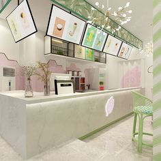 the interior of an ice cream shop with pictures on the wall