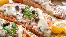 salmon with lemon sauce and capers served on a plate