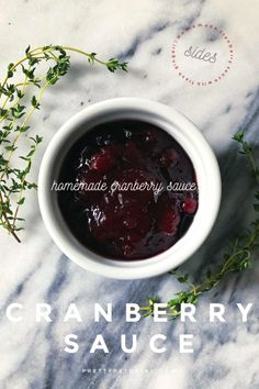 a white bowl filled with cranberry sauce sitting on top of a marble counter