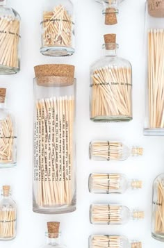 several bottles filled with matches on top of a table