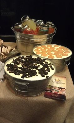 a table topped with lots of different types of desserts and snacks on top of it