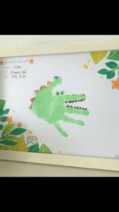 a handprinted picture of a green alligator