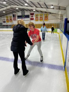 two women on an ice rink talking to each other