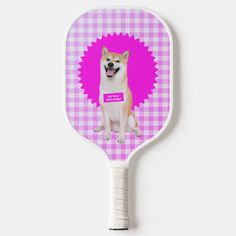 a pink and white checkered pattern with an image of a dog on it's back