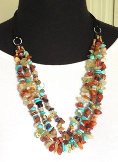 Handmade Multi Strand Jewelry Necklace/ Bead Necklace for Women/Boho Bead Leather Necklace/ Colorful Bead Necklace Jewelry/ gift for her. Statement Necklace, 3 strands of beads. Handmade artisan beads necklace, Attached to leather cord.  Handmade by myself in my home studio, avoid spraying with perfume. Made with turquoise, coral, carnelian, agate, quartz, jade. length is 20 inches I mail with USPS, packed and protected in a gift box. Handmade Bead Necklace, Handmade Turquoise Necklace, Leather Beaded Necklace, Earthy Necklace, Boho Chic Necklace, Multi Strand Beaded Necklace, Beads Craft Jewelry, Turquoise Statement Necklace, Beaded Jewelry Necklaces