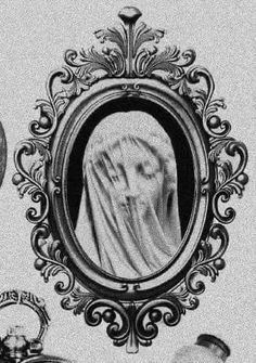 an old photo of a woman in a veil with other women around her looking into a mirror