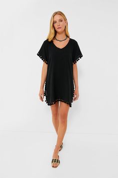 Easy, breezy and always ready for an adventure in the sun, the Katie Caftan is our go-to when picking a lightweight cover-up. Slightly sheer and detailed with pom-pom tassels, this V-neck dress is the perfect amount of chic and fun for an easy beach look. Just add your go-to suit and hat for a breezy, effortless feel– and don't forget the sunscreen! V-neckline Short sleeves Pom trim detailing Side slits Mini silhouette Slightly sheer Material: 100% Ramie Care: Wash separately in cold water Beachwear V-neck Cover-up With Tassels, Summer V-neck Cover-up With Tassels, Summer V-neck Tassel Cover-up, Casual V-neck Cover-up With Tassels, Vacation V-neck Kaftan With Tassel Ties, Casual Beach Cover-up With Tassels, Short Sleeve Beach Dress With Tassels, Beach Season V-neck Dress With Tassels, Beach Dresses With Tassels And Short Sleeves