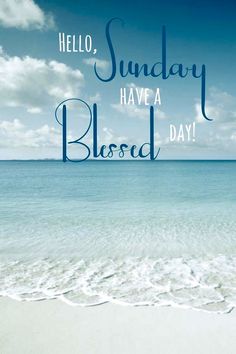 the words hello, sunday have a blessed day written in blue ink on a sandy beach