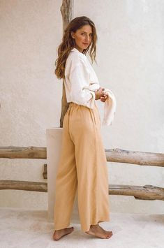 These timeless, slightly loose fitting and wide-legged linen pants are sure to become a favourite in your wear-forever summer closet. Crafted from mid-weight, super soft 100% French Flax Linen, you will wear them on repeat on all your warm weather days. The slightly high-waisted, elasticated waistband serves extra comfort while the effortless design works equally well for everyday vaycay wear as for sophisticated al fresco dining by the seaside. The side pockets feature beige lining to reduce tr Trousers Linen, Long Linen Pants, Spring Tones, True Spring, Boho Clothes, Shirt Dress Summer, Summer Closet, Compost Bags, Travel Pants