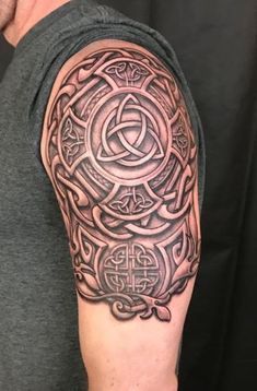 a man with a celtic tattoo on his arm