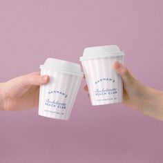 two people holding up coffee cups in front of a pink background with the words banana ice cream on them