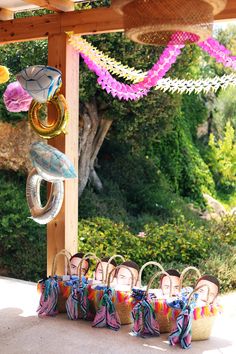 an outdoor area with baskets and hanging decorations