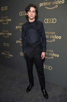 an image of a man in black suit and tie at the amazon prime video event