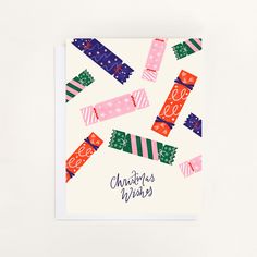 a christmas card with colorful ribbons on it