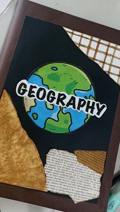 a close up of a piece of paper with the word geography on it